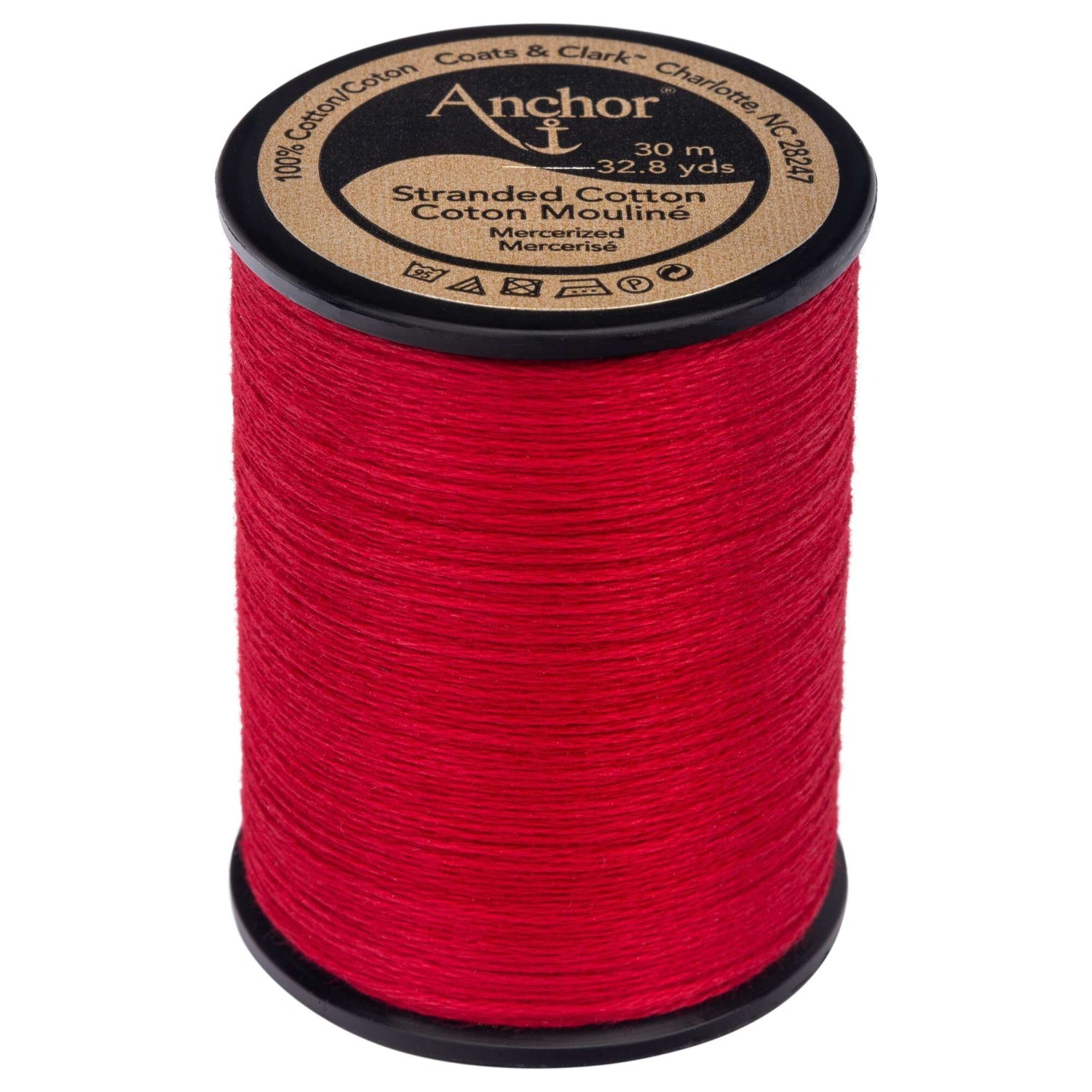 Anchor brand red embroidery floss on a large black plastic spool